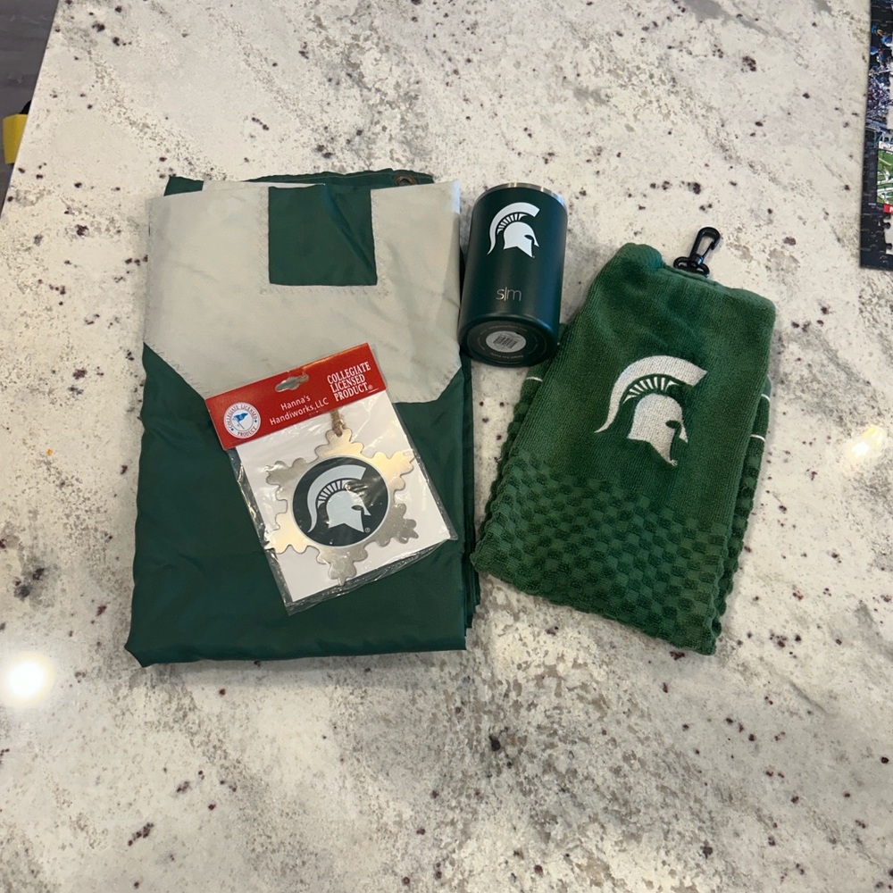 MSU Spartans flag, SM can cooler, golf towel, metal ornament. Green and white